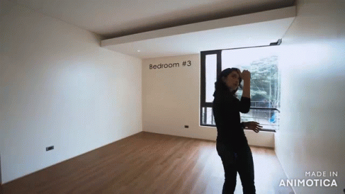 a woman talking on a cell phone in a room