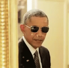 the president wearing sunglasses and looking through his eyes