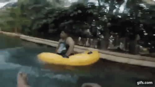 a blurry picture of a man in an inflatable boat with a fish