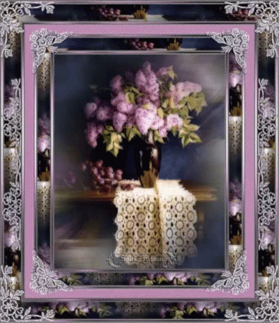 a decorative frame with a vase of flowers