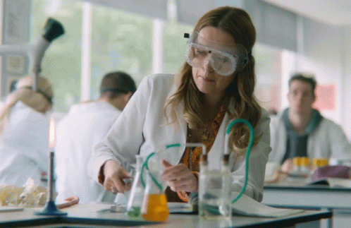 young women are doing experiments in science class