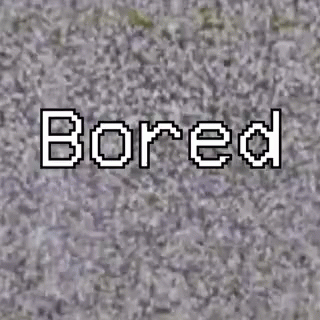 the word bored written over a grey surface