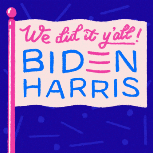 a hand holding a sign that says we did it late biden harris