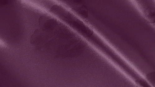 an up close view of purple satin fabric