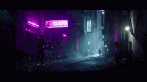 two people stand outside of a purple lit bar