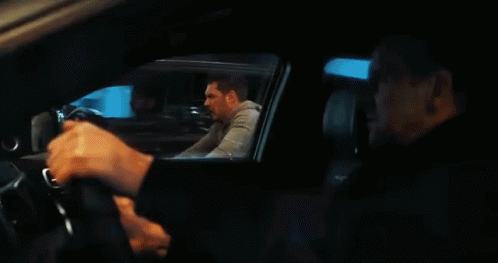 two men in cars talking to each other