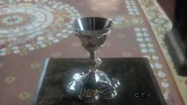 a pew cup that is standing on a table