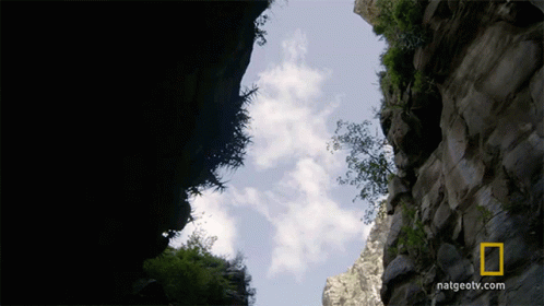 there is a view of a canyon looking down at clouds