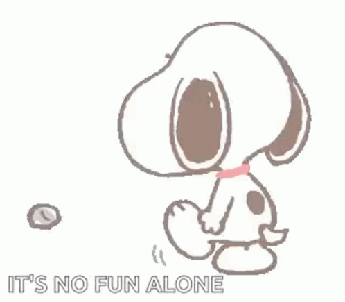 a white snoopy is playing with an object