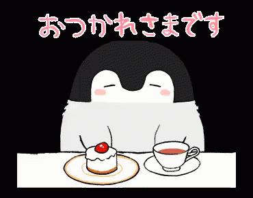 a penguin sitting at a table next to a cup of coffee
