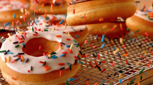 there are lots of doughnuts with white frosting