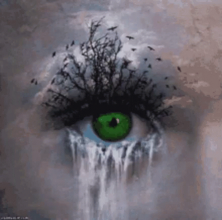 the eye is painted green with trees growing out of it