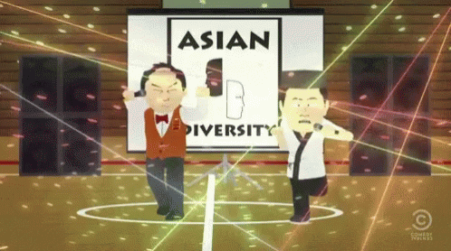 three people standing in front of an asian convention sign
