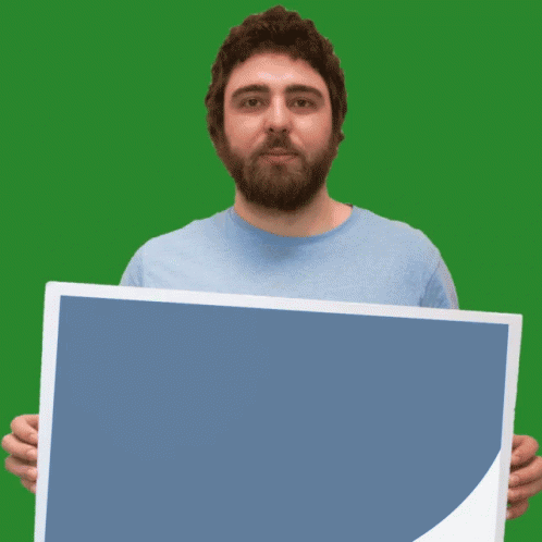 the man has a beard and is holding a large square
