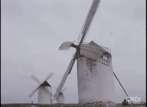 this is an old po of a windmill and boat