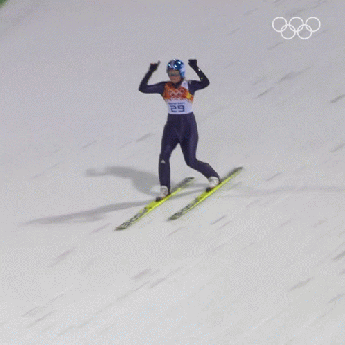 skier in blue competing at an event in the winter olympics