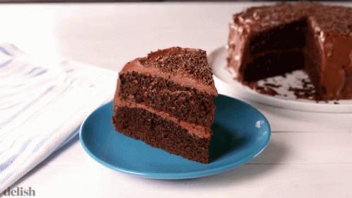two slices of cake sitting on plates next to each other