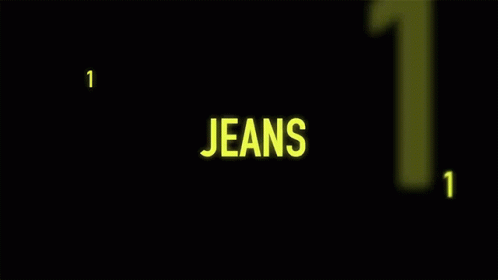 the word jeans in green glows on a dark background
