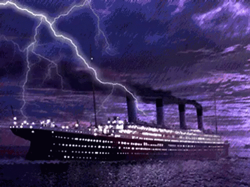 a large ship on a body of water under a purple sky