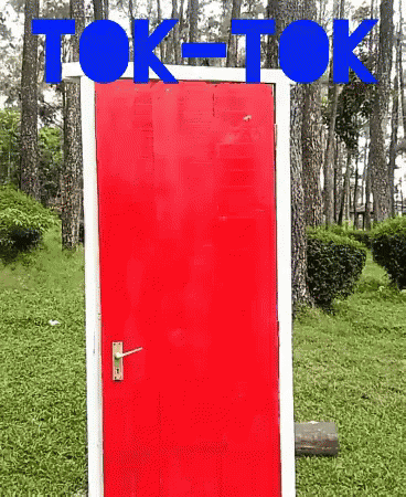 a red text box over a doorway is in front of the green grass