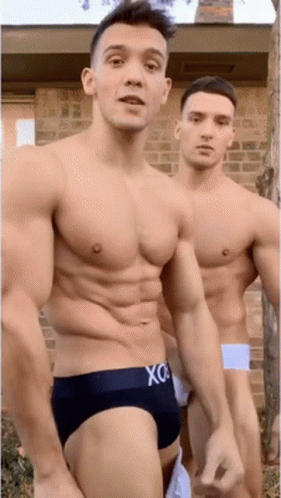 two  men with boxers standing next to each other