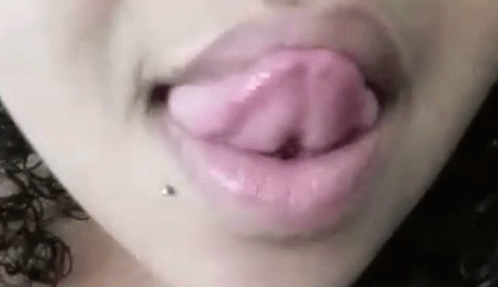 someones lips have purple powder on them and they are dripping