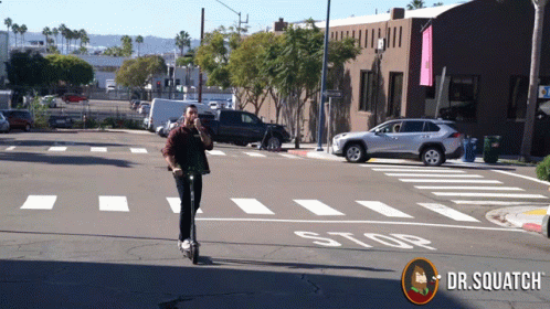 a person riding a skateboard down the road