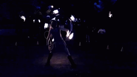 a woman dancing in the dark on her belly