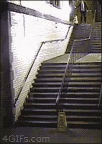 a black and white po of someone going down a stairwell