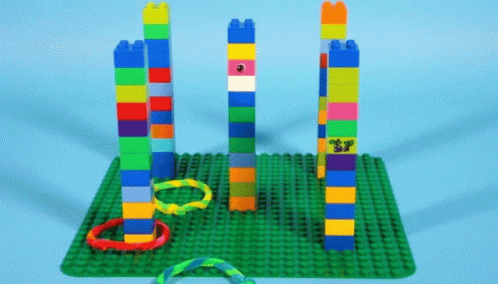 a group of toys made out of legos sitting on top of a rug