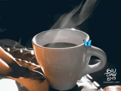 a coffee cup with a erfly on top