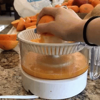 someone mixing liquid in an ice cream container