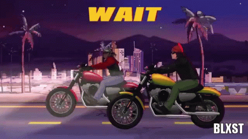 two men riding on motorcycles together at night