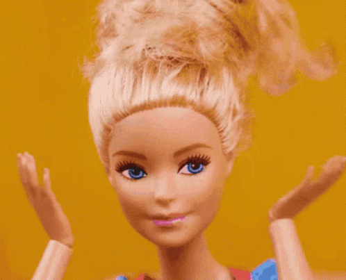 a barbie doll has yellow eyes and white hair