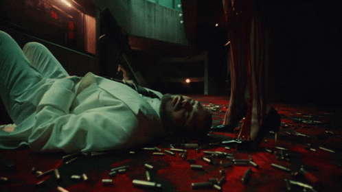 a man laying on the floor with several confetti strewn around him