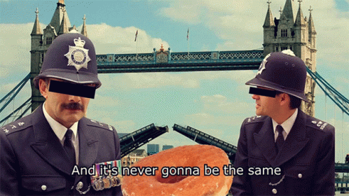 the two cops are in front of a bridge