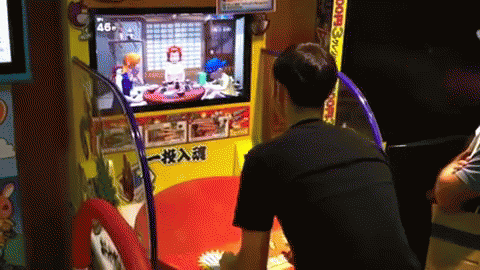 two men playing a game on an interactive video game system