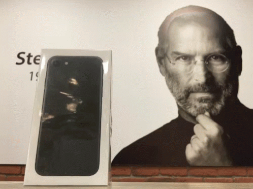a black iphone in the packaging box