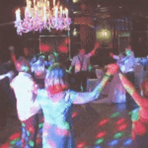 a dance party with a disco dancers all dressed in colored costumes and dancing