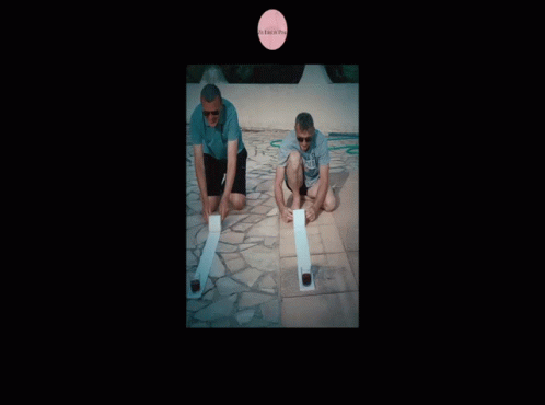 two men kneeling on tiled floors with bat's