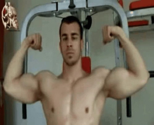 a picture of a man in his gym room flexing his muscles