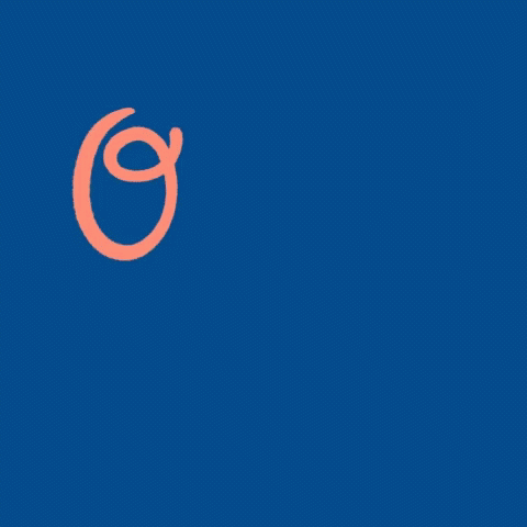 an orange wall with a blue letter g on it