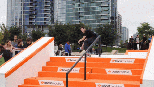 a man riding down the side of steps on top of stairs