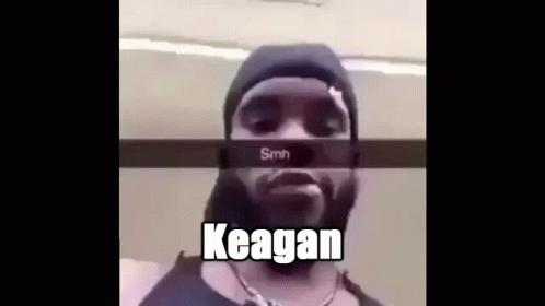 a black man in a hoodie that is behind the word kegan