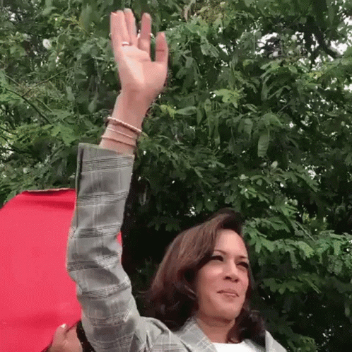 a woman with her hands in the air