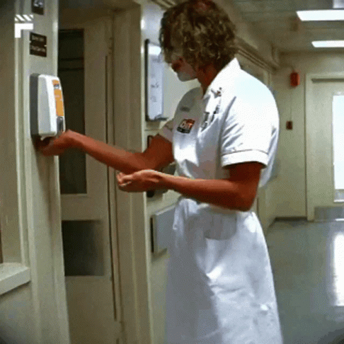 the nurse is entering through a blue door