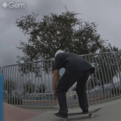 man riding skateboard up side down ramp