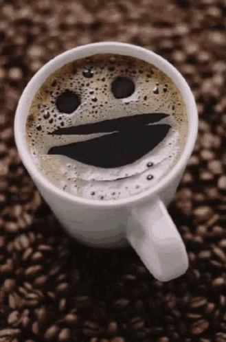 coffee cup with mouth and nose drawn on it