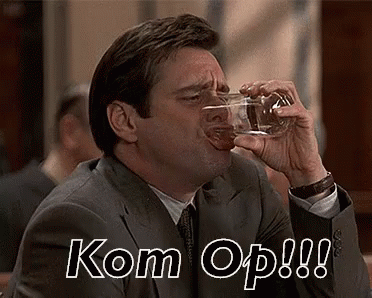 a man drinking from a glass with text reading kom opp