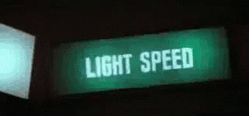 green light speed sign with a dark background
